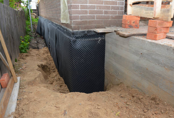 Happy homeowners after waterproofing job in Oolitic